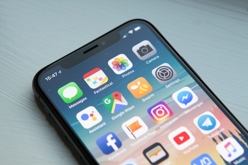 Smartphone displaying a wellness meditation app with a calm background